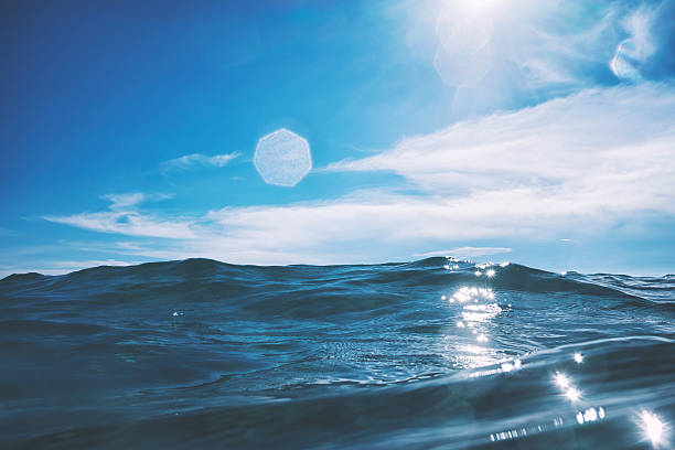 istock Water surface in the middle of the ocean against sunlight 610876200
