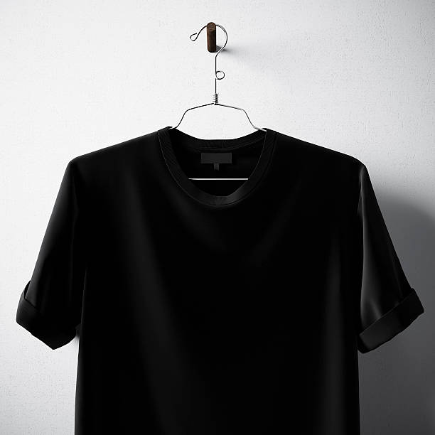 istock Closeup Black Blank Cotton Tshirt Hanging Center White Concrete Wall 610876436