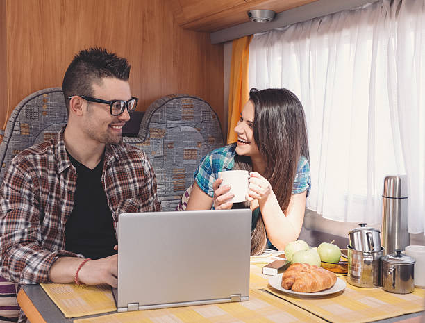 istock Couple on a road trip with campervan 610876568