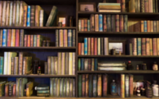 blurred  Image Many old books on bookshelf in library stock photo