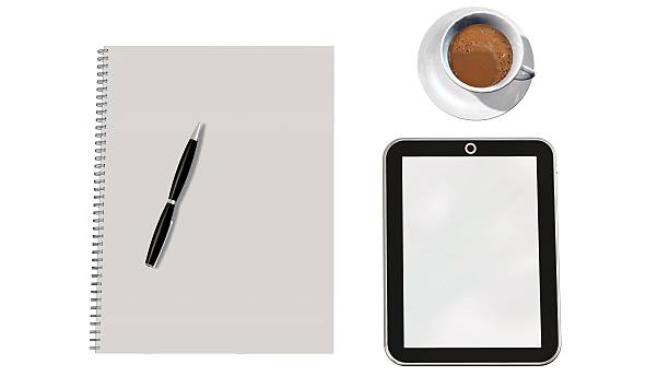 Top View of Modern Technology working Place on wooden Office Desk with large Desktop Computer Coffee Mug Keyboard and Mouse green Flower Notepad and Pen