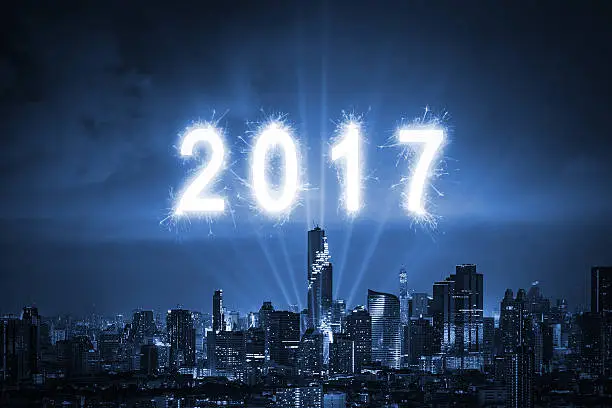 Happy newyear 2017 light with city background