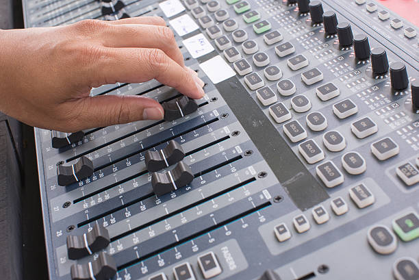 istock music equipment,Hand adjust audio mixer music 610878088