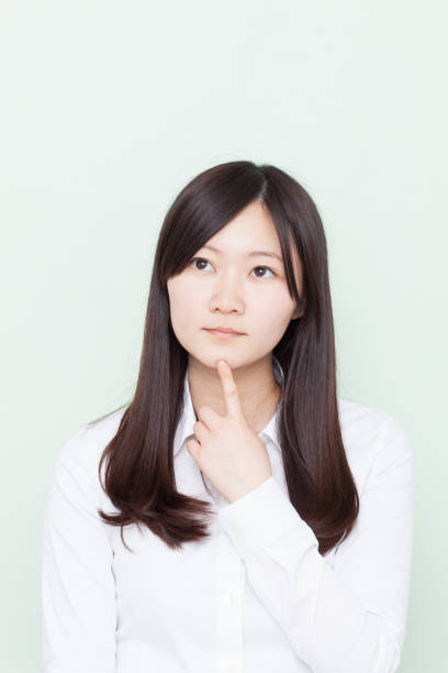 istock Japanese woman making gestures 610879700