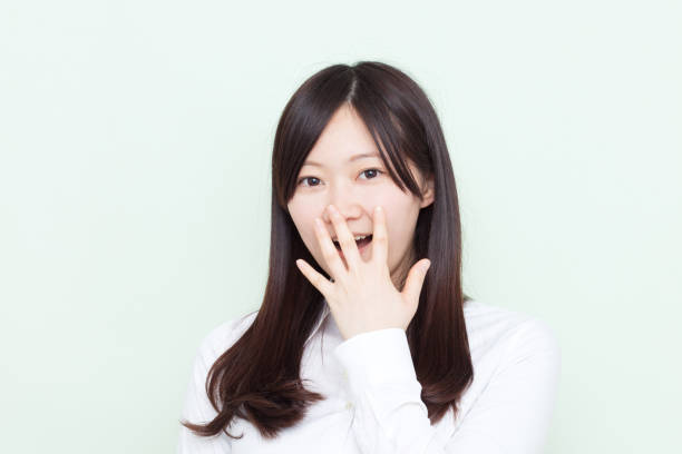 istock Japanese woman making gestures 610880136