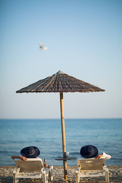 istock two sisters enjoying on the beach 610881348