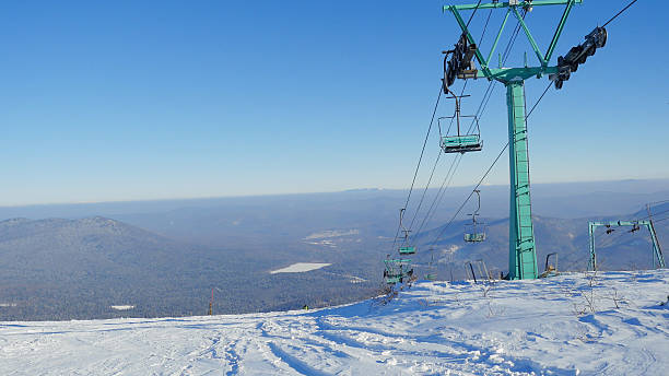 istock Ski lifts on the bright winter day 610881982