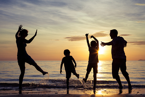 Silhouette of happy family who playing on the beach at the sunset time. Concept of friendly family.Father and son playing on the beach at the sunset time. Concept of friendly family.Silhouette of happy family who playing on the beach at the sunset time. Concept of friendly family.Father and son playing on the beach at the sunset time. Concept of friendly family.Silhouette of happy family who playing on the beach at the sunset time. Concept of friendly family.Father and son playing on the beach at the sunset time. Concept of friendly family.