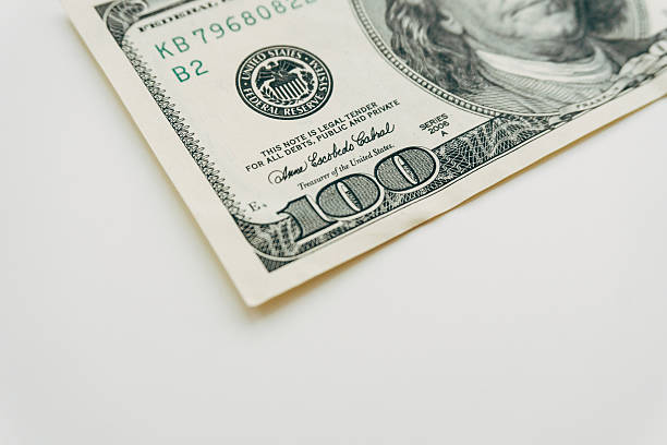 istock one hundred dollar bill closeup on white background 610944236