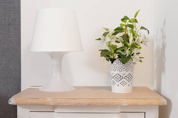 istock Nightstand with Lamp and Plant 610944714