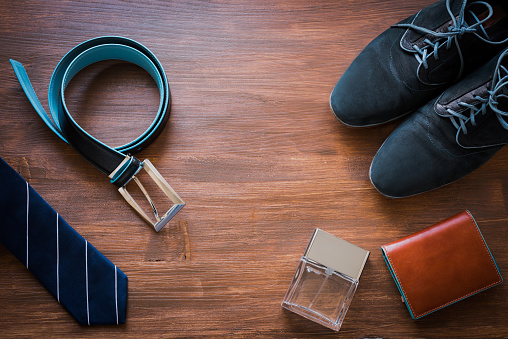 Men fashion accessories. Men wallet, belt, shoes and tie. Still life.