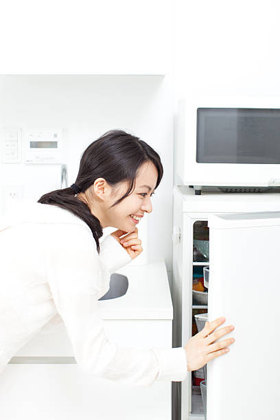 istock Japanese woman in the kitchen 610950024