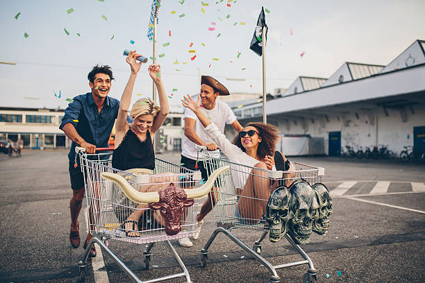 istock Young friends racing with shopping carts 610950396