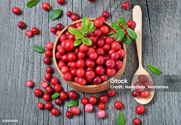 Cowberry In Wooden Bowl On Rustic Surface Stock Photo - Download Image Now - Basket, Circle, Food