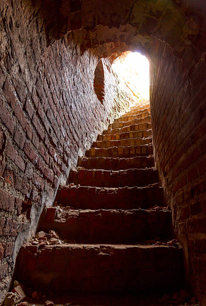 istock stone corridor with stairway in tower 610951510