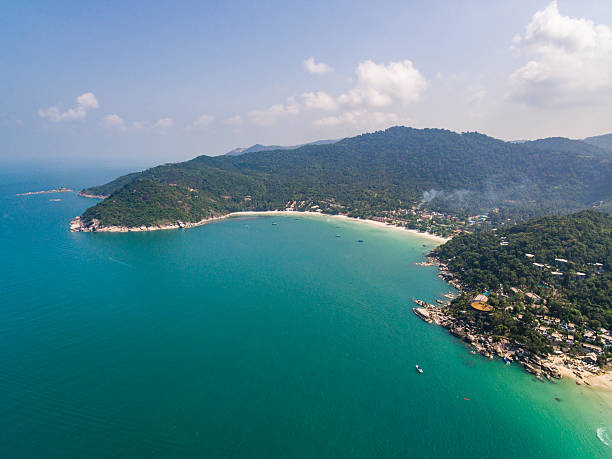 istock Aerial view of beach with boats 610953696