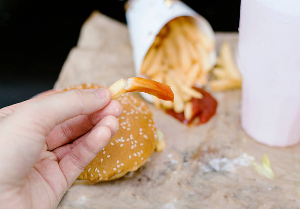 istock greasy fast food meal with burger and fries 610955202