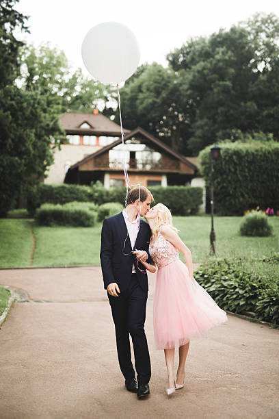 istock Loving couple on the background of the setting sun, . Just 610955426