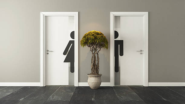 white restroom doors for male and female stock photo