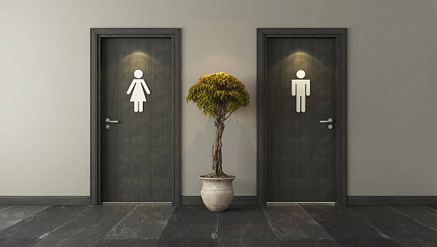 puertas de baño negras para hombres y mujeres - puertas baños fotografías e imágenes de stock