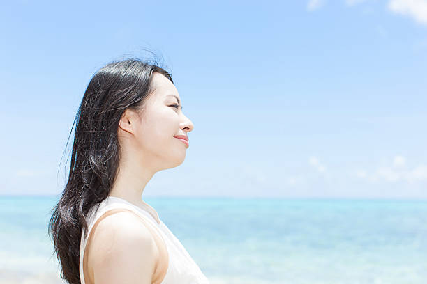 istock Japanese woman on the beach 610956778