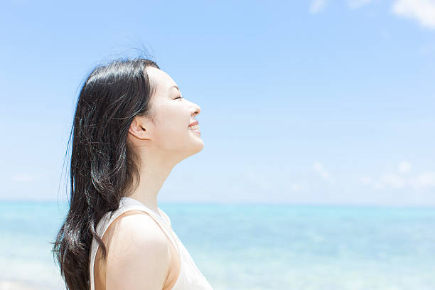 Japanese woman on the beach stock photo