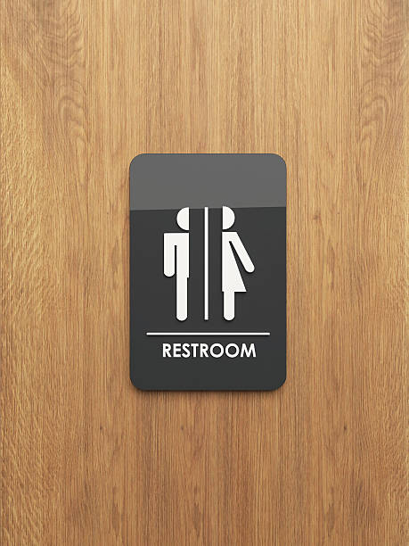 istock public restroom sign on the wood 610957752