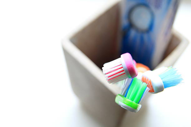istock Shallow DOF shot of three toothbrushes and toothpaste in a 610958388