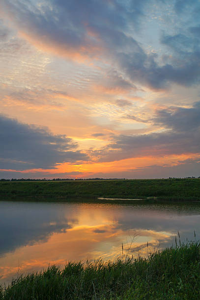 istock Beautiful sunset on the river vertical background 610958814