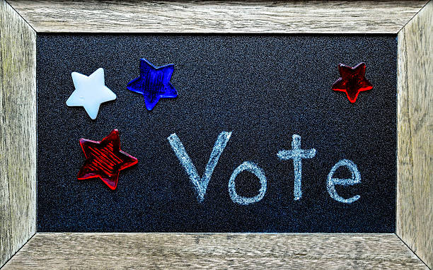 Vote, surrounded by red, white and blue stock photo