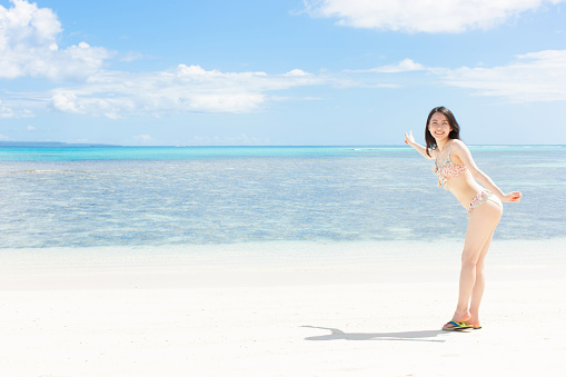 Japanese woman wearing bikini on the beach