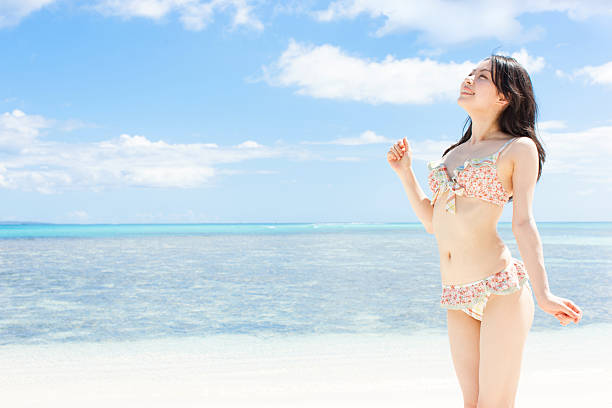 Japanese woman wearing bikini on the beach