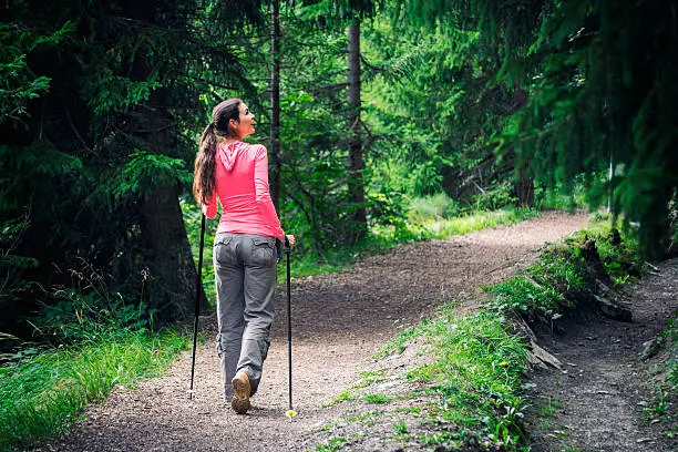 While the rest of the world is busy, a woman is enjoying the silence in the forest. Shot in Valais, Switzerland.