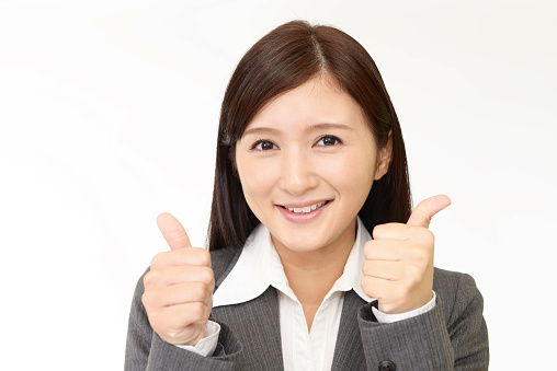 Business woman showing thumbs up sign