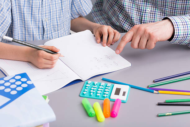 istock Maths is not hard at all when you have a good teacher 610964478