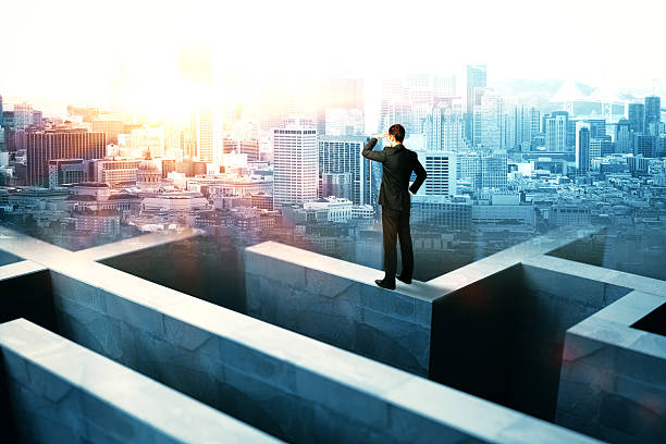 Businessperson on maze wall