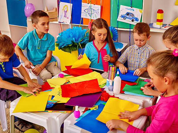 istock Children are making something out of colored paper. 610965854