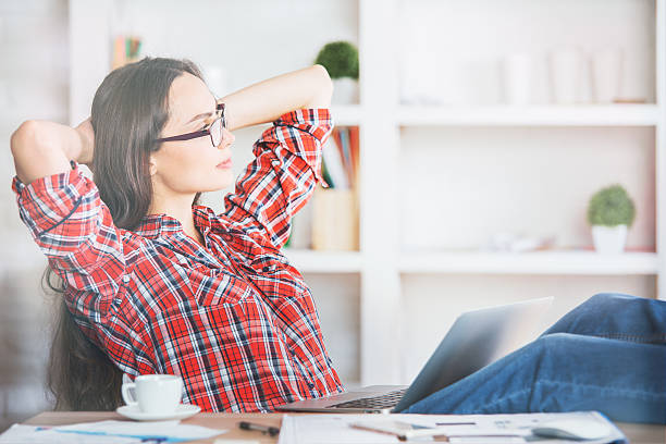 istock Gorgeous female relaxing in office 610965978
