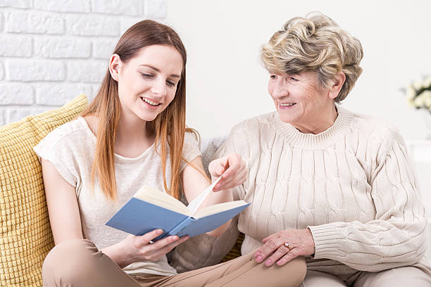 istock Sharing a good piece of read with her 610966194