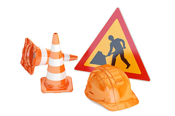 istock Traffic cones, hardhat and road sign. Under construction concept 610966418
