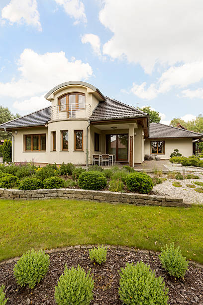 istock Beautiful villa with garden idea 610967568