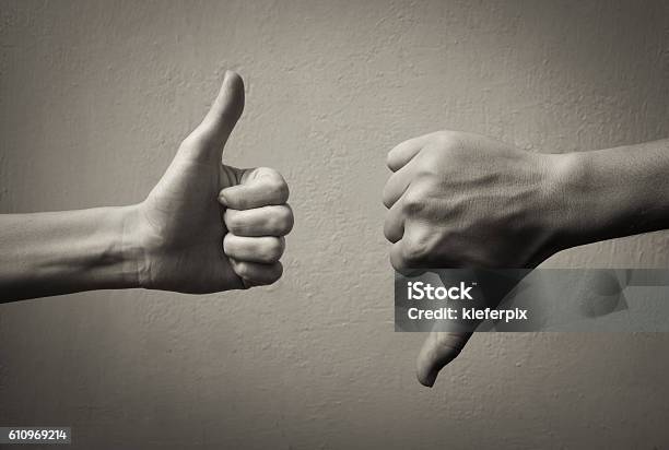 Thumbs Up Thumbs Down Stock Photo - Download Image Now - Negative Emotion, Arguing, Rudeness