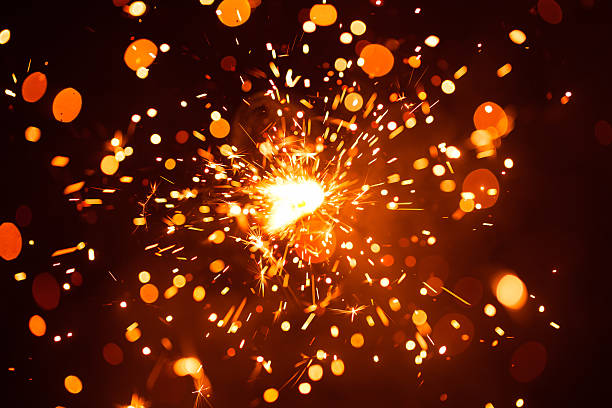 istock Christmas sparkler in haze with red light 610969442