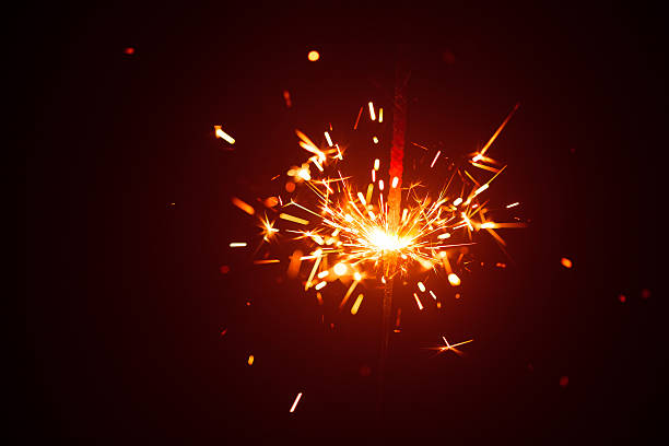 istock Christmas sparkler in haze with red light 610969504