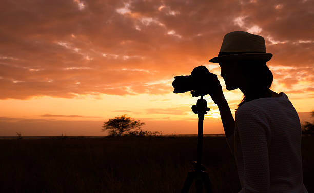 istock Woman photographer in nature setting 610969676
