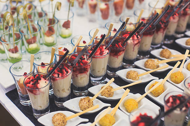 Beautifully decorated catering banquet table with different food snacks appetizers