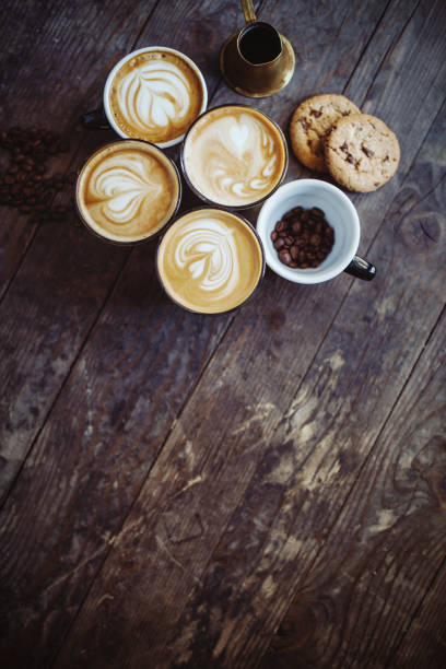 istock Coffee cups decorated with froth art - Background 610970084