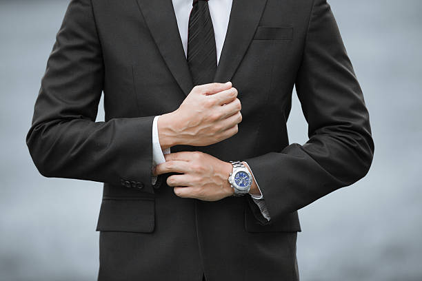 Man wearing suit and watch