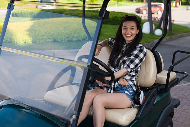 istock The woman is in a golf cart 610971922
