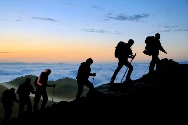 istock Silhouettes of hikers At Dusk 610972000